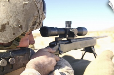 A soldier aims in with his M40A3 Scout Sniper Rifle