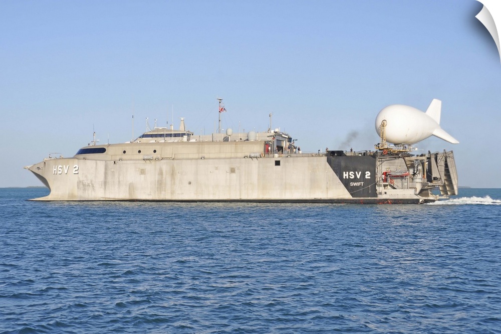 Key West, Florida, April 24, 2013 - The Military Sealift Command high-speed vessel Swift (HSV-2) with a tethered TIF-25K a...