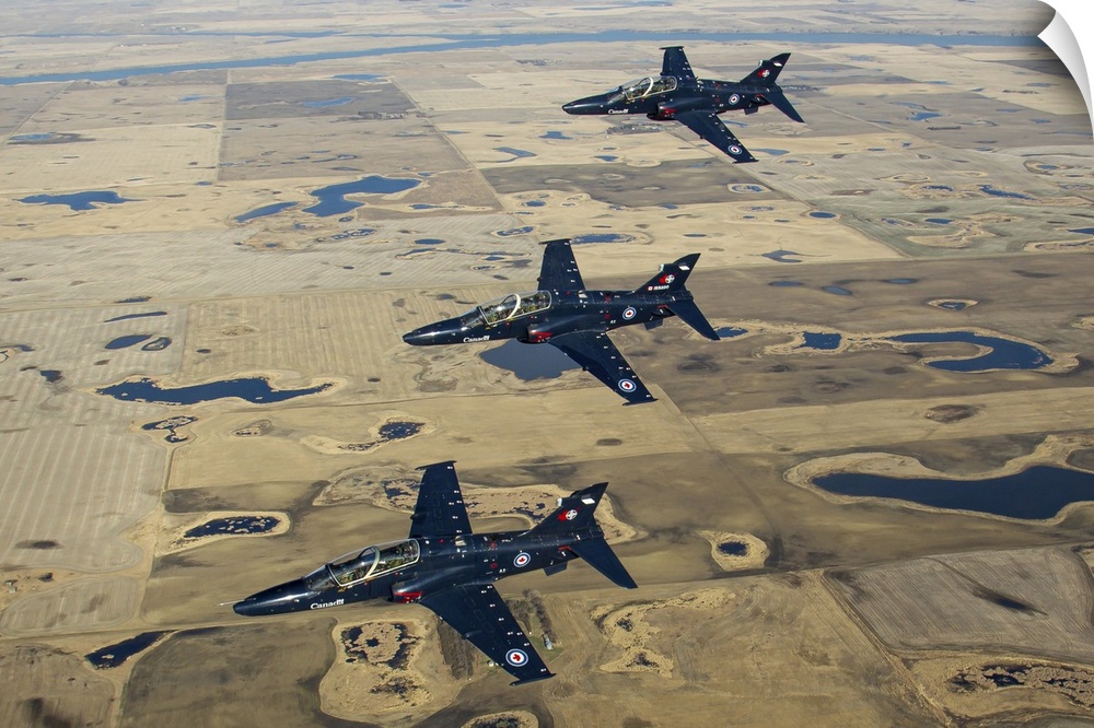 A trio of Royal Canadian Air Force CT-155 Hawk training jets on a formation flying training flight from their homebase Moo...
