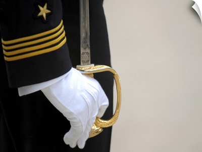 A U.S. Naval Academy midshipman stands at attention