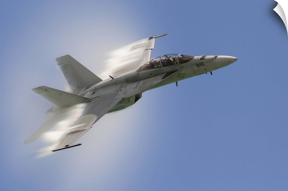 A U.S. Navy F/A-18F performs a fast pass over Chicago, Illinois.
