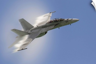 A U.S. Navy F/A-18F performs a fast pass over Chicago, Illinois