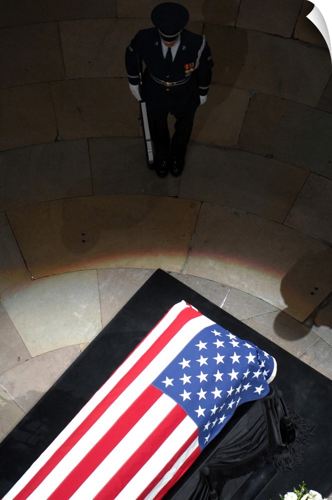A U.S. Air Force Honor Guardsman stands watch over the casket.