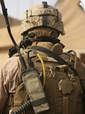 A vehicle commander with his radio equipment attached to his vest