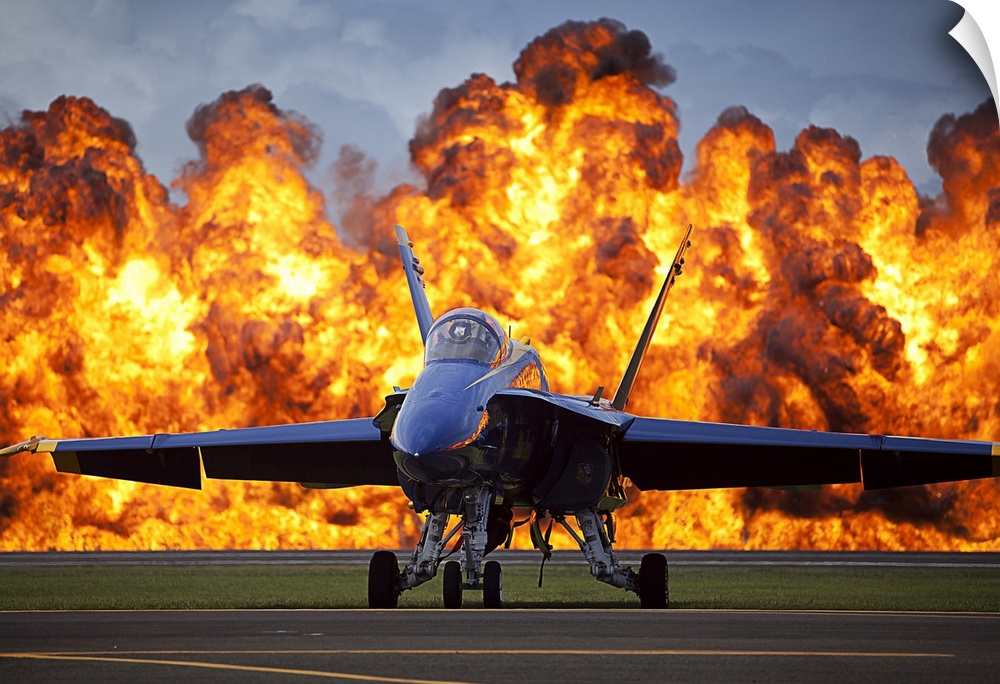 September 28, 2012 - A wall of fire erupts behind a U.S. Navy F/A-18 Hornet aircraft with the Blue Angels, the U.S. Navy f...