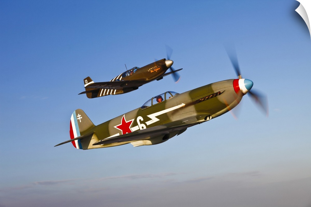 A Yakovlev Yak-9 fighter plane and a North American P-51A Mustang in flight near Chino, California.