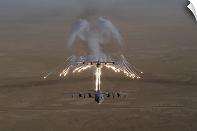 Aerial shot over Iraq of a KC-130 Stratotanker firing flares