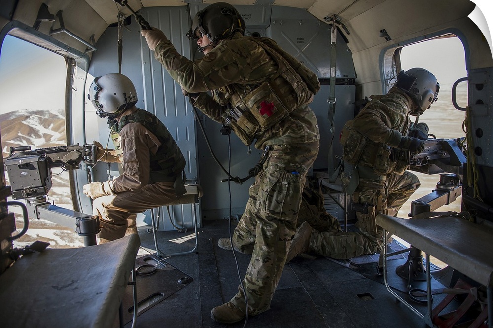 Afghan Air Force members inside of a Mi-17 helicopter over Kabul, Afghanistan.