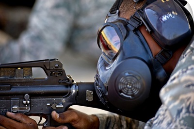Air Force Basic Military Training Trainee Fires At His Target While Wearing His Gas Mask