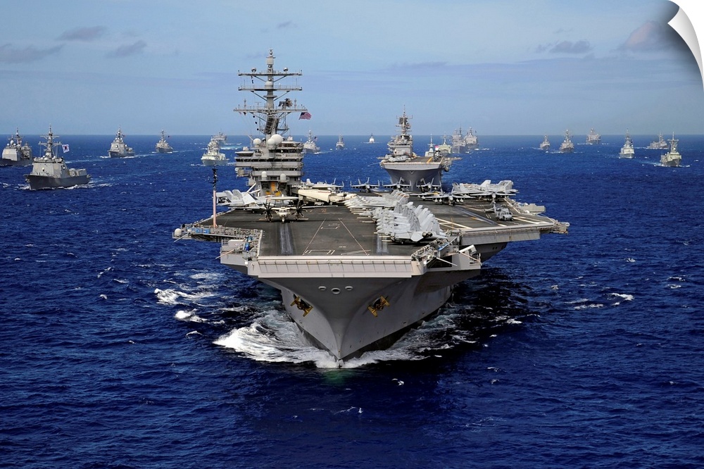 The Nimitz-class aircraft carrier (CVN-76) leads a mass formation of ships from Korea, Taiwan, Japan, Singapore, France, C...