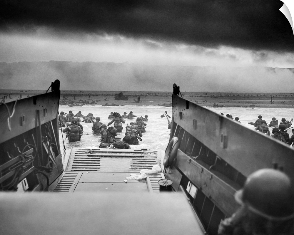 Digitally restored vintage World War II photo of American troops wading ashore on Omaha Beach during the D-Day invasion on...