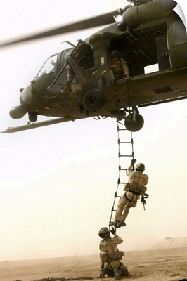 An Air Force HH-60G Pavehawk deploys pararescuemen