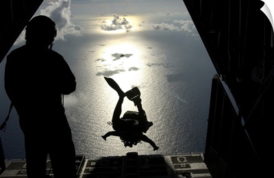 An Air Force Pararescueman Jumps Out Of The Back Of An HC-130 Hercules