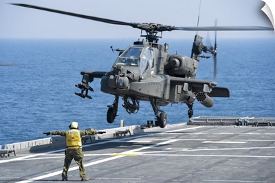 An Army AH-64D Apache helicopter prepares to land aboard USS Ponce
