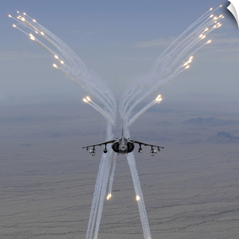 July 27, 2010 - An AV-8B Harrier fires flares during a training flight. The flares are meant to misguide any heat-seeking ...