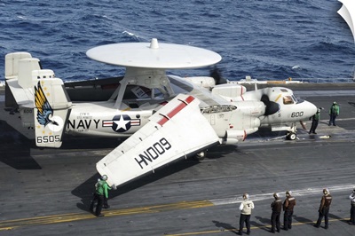 An E-2C Hawkeye on the flight deck aboard USS Nimitz