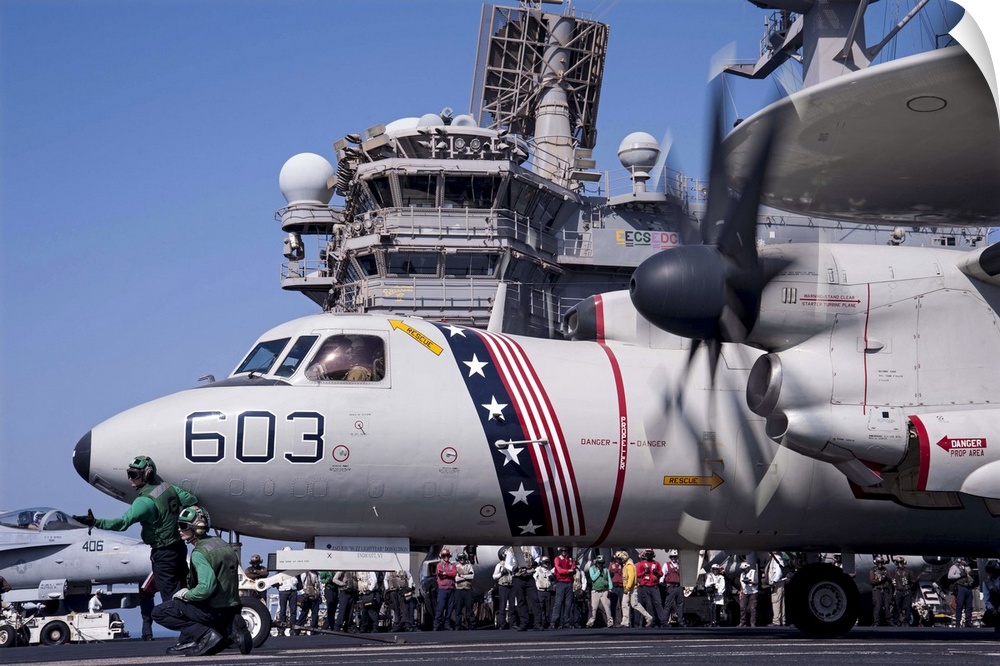 Arabian Gulf, August 23, 2014 - An E-2C Hawkeye prepares to launch from the flight deck of the aircraft carrier USS George...