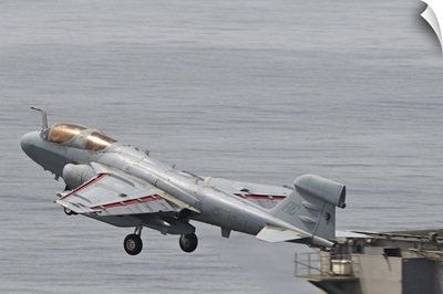 An EA-6B Prowler lifts off from the flight deck of USS Harry S. Truman