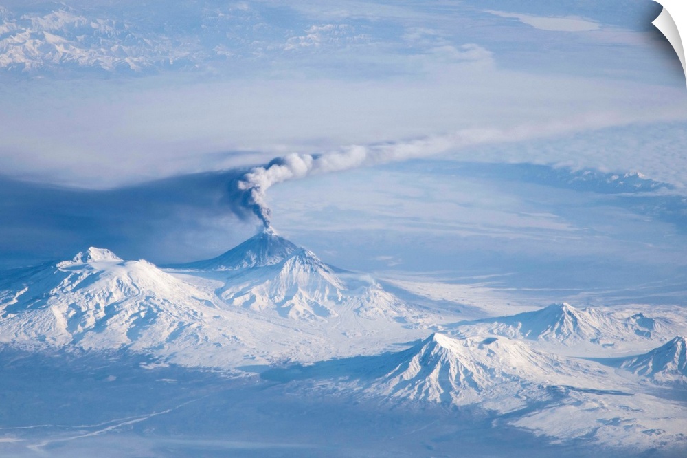 An eruption plume emanating from Kliuchevskoi, one of the many active volcanoes on the Kamchatka Peninsula. The plume, lik...