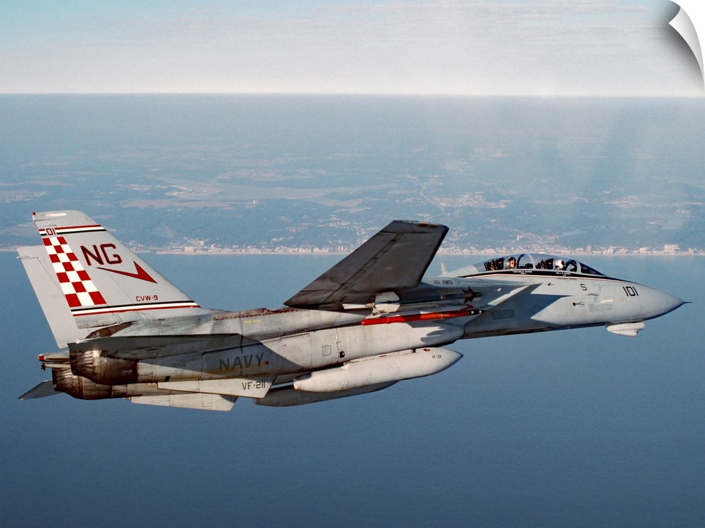 An F-14A Tomcat of U.S. Navy Fighter Squadron 211 (VF-211, the Fighting Checkmates) cruises near Virginia Beach during a m...