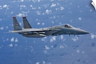 An F-15 Eagle flies over the Pacific Ocean during a training mission