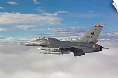 An F-16 Fighting Falcon flies with an AGM-65 Maverick missile