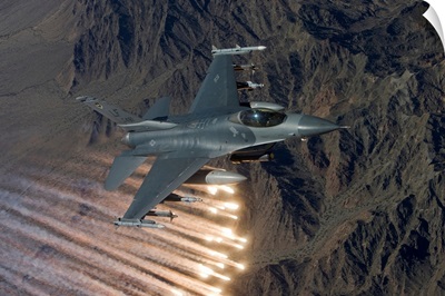An F-16 Fighting Falcon releases flares during a training mission
