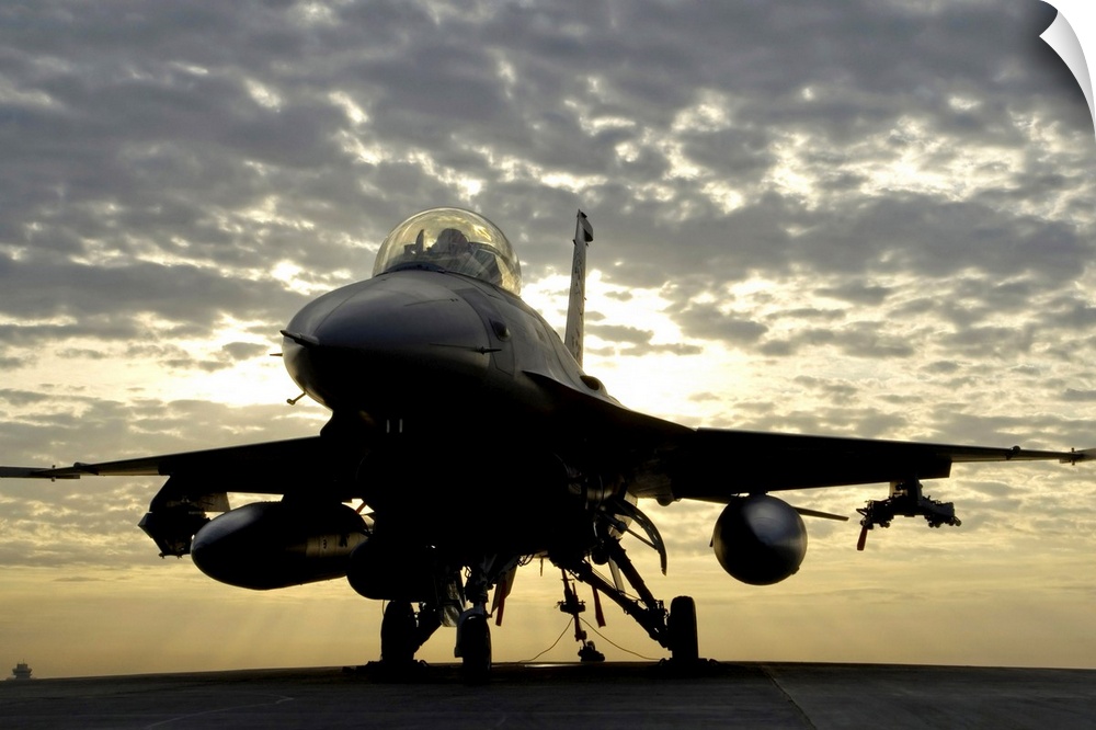An F-16 Fighting Falcon sits tethered to the hot cargo pad at Joint Base Balad, Iraq.