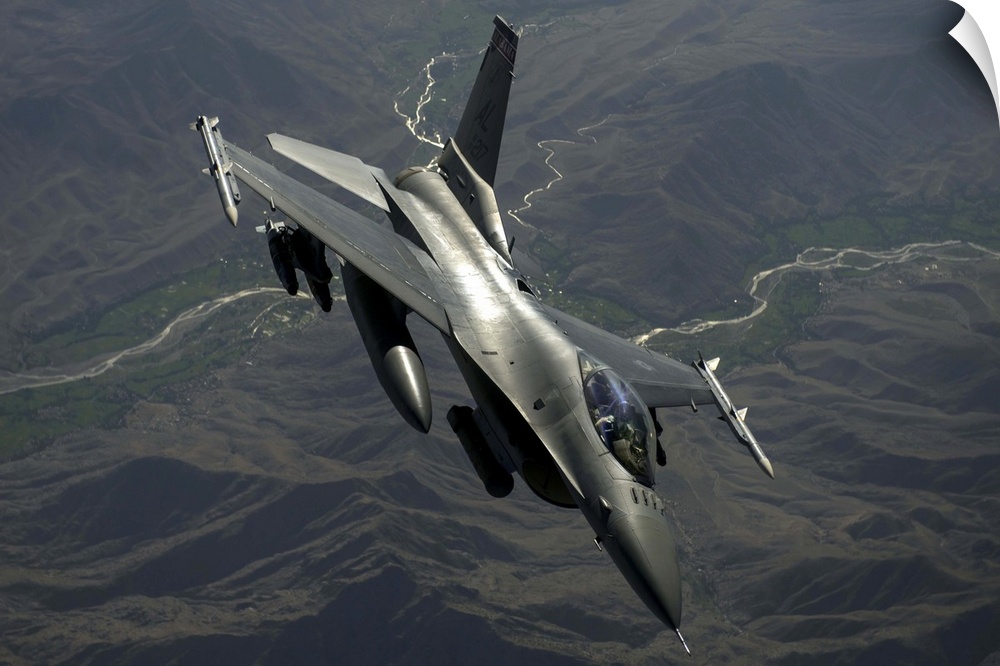 July 22, 2014 - An F-16C Fighting Falcon flies over Afghanistan after an in-air refueling mission in support of Operation ...