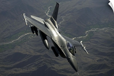 An F-16C Fighting Falcon flies over Afghanistan