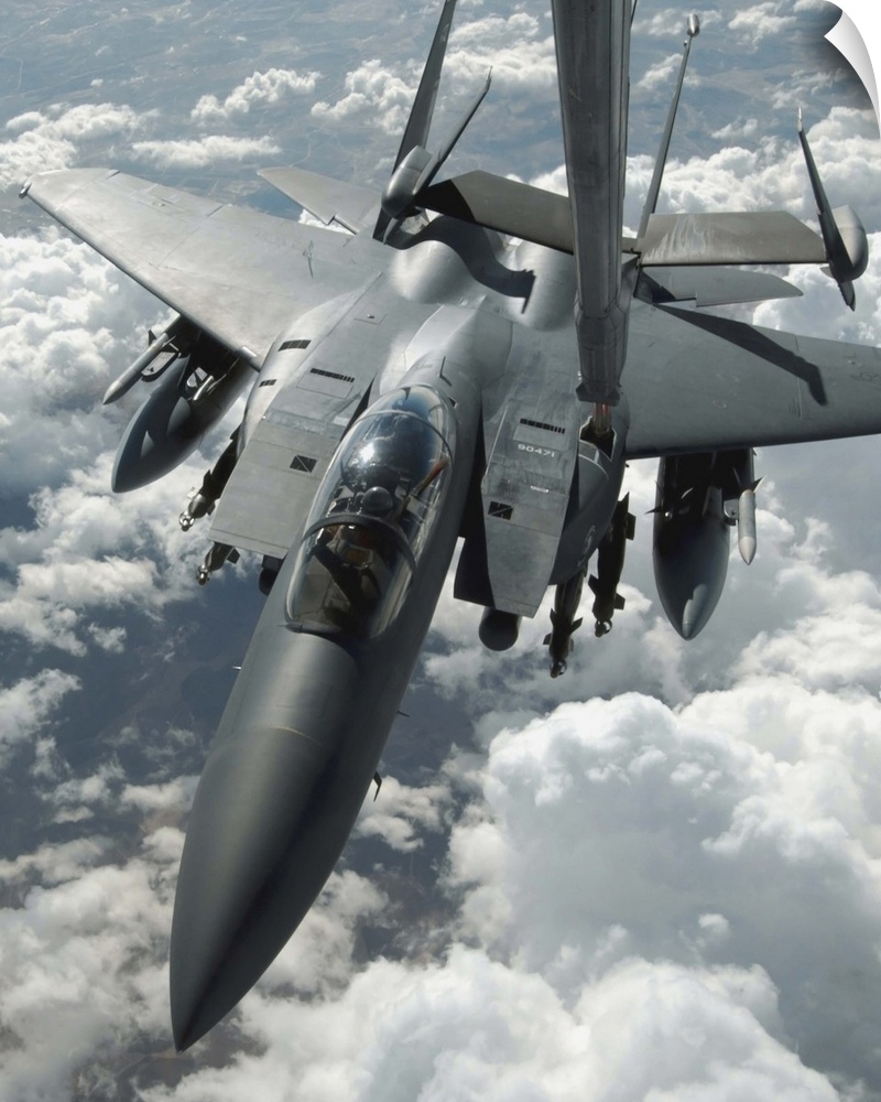 An F15 E Strike Eagle receives fuel from a KC10 Extender