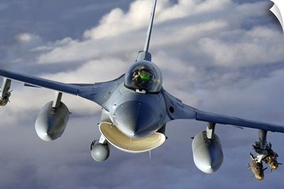 An F16 Fighting Falcon soars through the sky