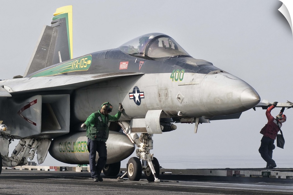 A U.S. Navy F/A-18 Super Hornet assigned to Squadron VFA-105 is ready to launch from a catapult aboard USS Harry S. Truman...
