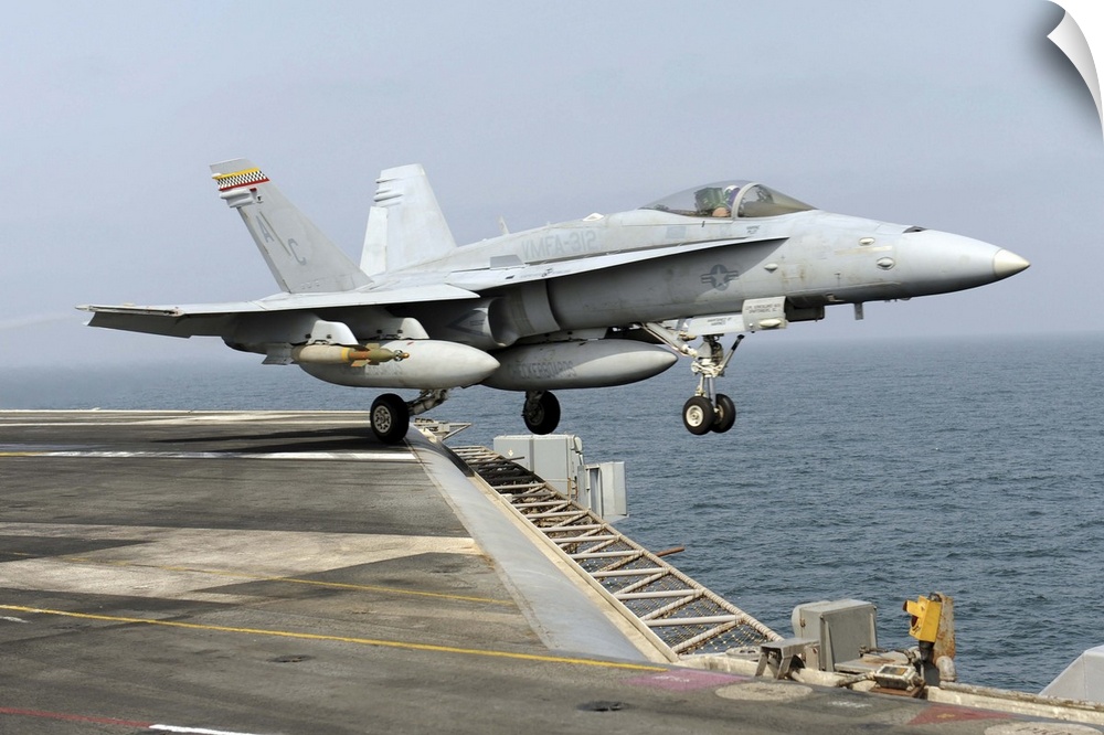 Arabian Sea, September 17, 2010 - An F/A-18C Hornet launches from the aircraft carrier USS Harry S. Truman (CVN-75). VMFA-...