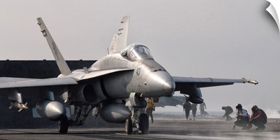 An F/A-18C Hornet ready to launch from the flight deck of USS George H.W. Bush