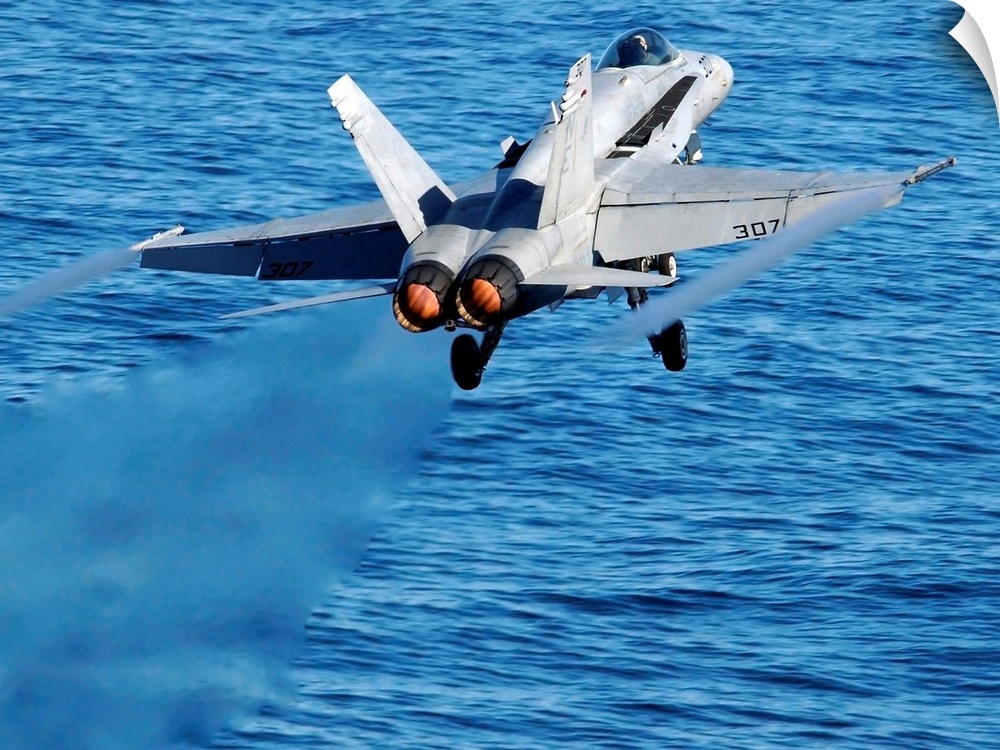 An F/A-18C Hornet taking off.