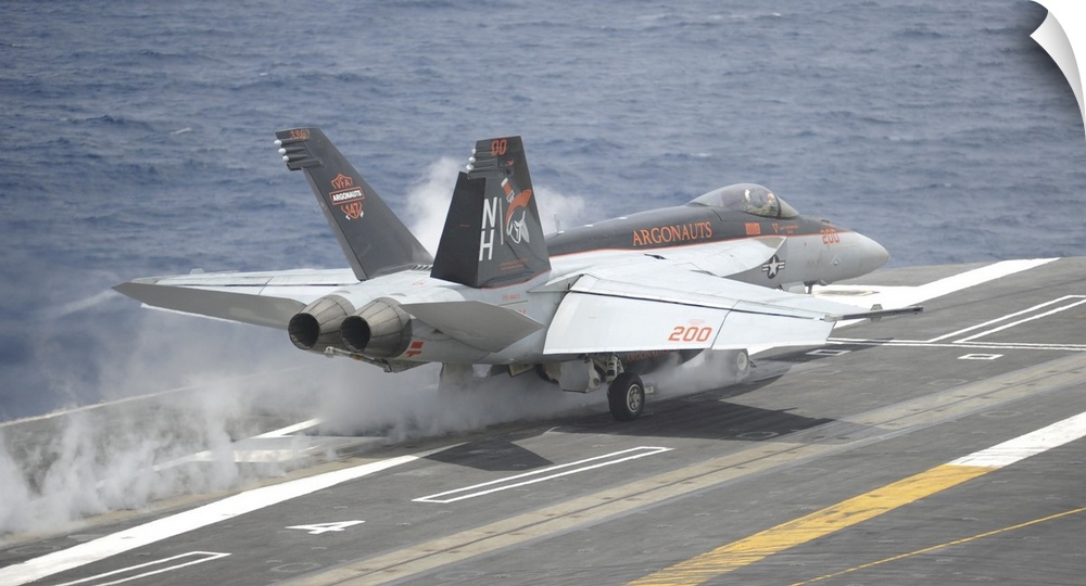 Pacific Ocean, May 5, 2014 - An F/A-18E Super Hornet launches from the aircraft carrier USS Nimitz (CVN 68).