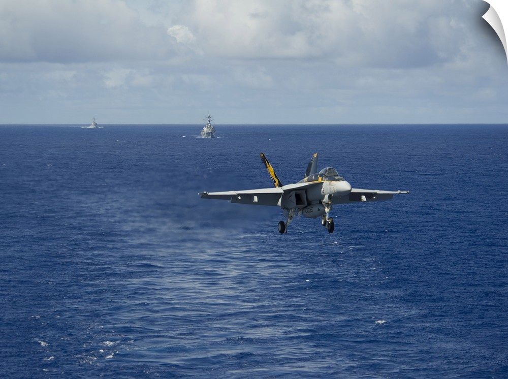 Philippine Sea, August 20, 2013 - An F/A-18E Super Hornet prepares to make an arrested landing on the flight deck of the a...
