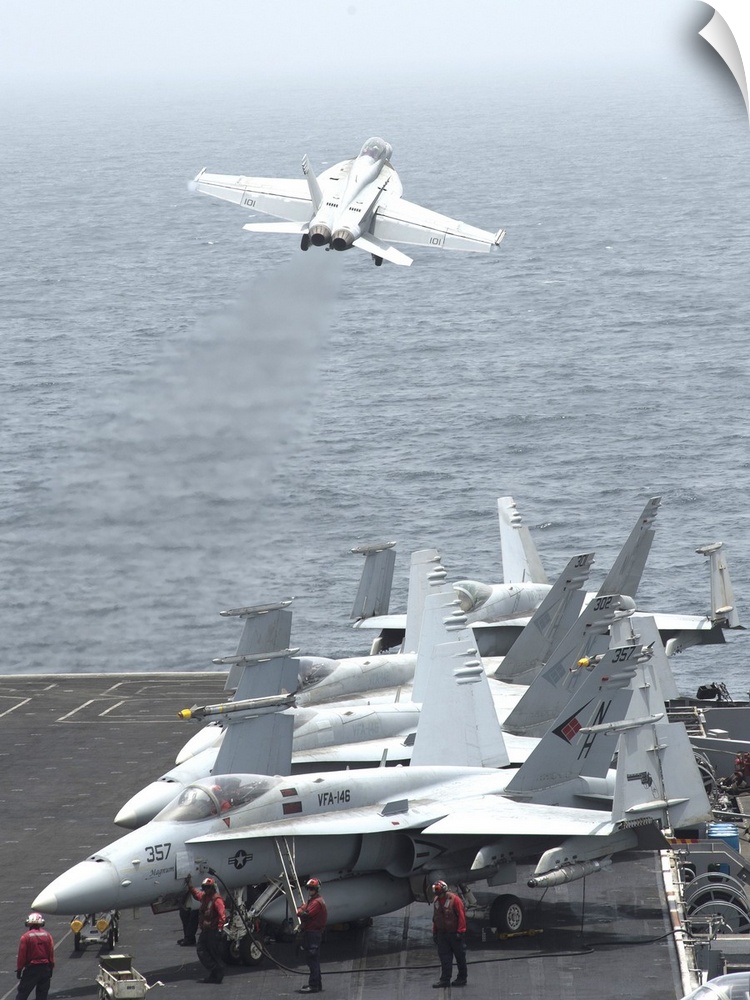 Gulf of Oman, July 13, 2013 - An F/A-18F Super Hornet  launches from the flight deck of the aircraft carrier USS Nimitz.