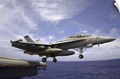 An F/A18F Super Hornet launches from the flight deck of USS Kitty