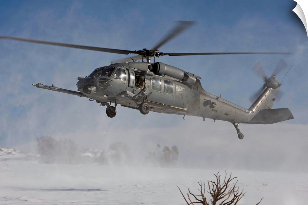 An HH-60G Pave Hawk from the 512th RQS fly's low over a landing zone during a training mission out of Kirtland Air Force B...