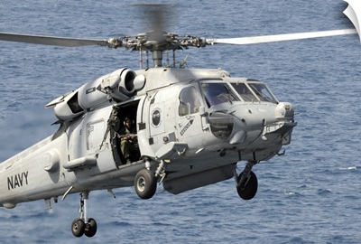 An HH-60H Sea Hawk Helicopter Prepares To Land Aboard The USS Dwight D Eisenhower