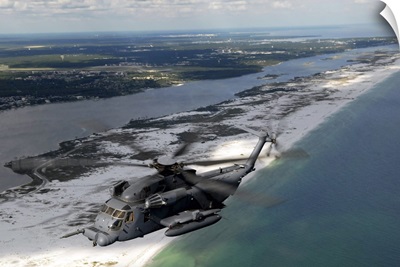 An MH-53 Pave Low flies over the coastline of Florida