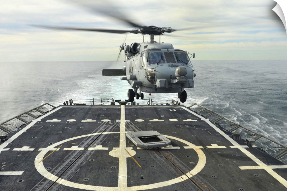 Atlantic Ocean, January 15, 2014 - An MH-60R Sea Hawk helicopter lands aboard the guided-missile frigate USS Halyburton (F...