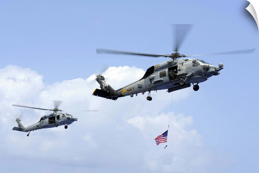Pacific Ocean, April 20, 2013 - An MH-60S Sea Hawk helicopter follows behind an MH-60R Sea Hawk helicopter during an air p...