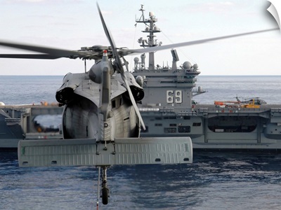 An MH-60S Seahawk Hovers Prior To Taking A Load Of Ammunition To USS Dwight D Eisenhower