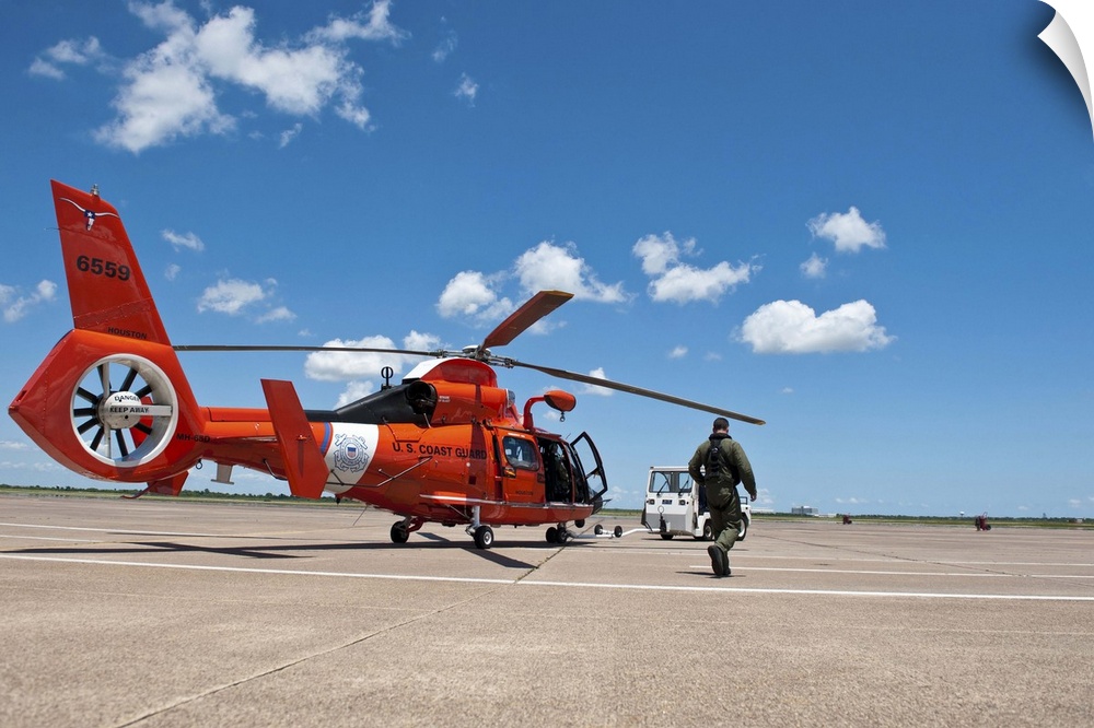 June 4, 2013 - A U.S. Coast Guard Air Station Houston aircrew prepares to launch a MH-65C Dolphin helicopter.
