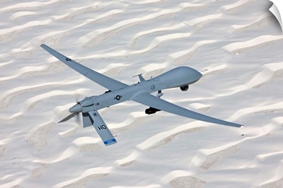 An MQ-1 Predator flies over the White Sands National Monument, New Mexico