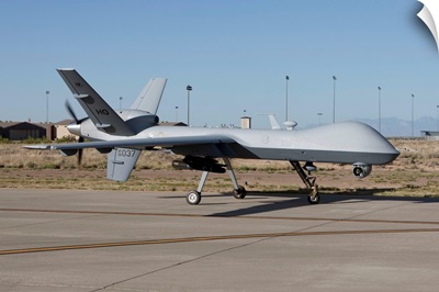 An MQ-9 Reaper taxies to the runway at Holloman Air Force Base