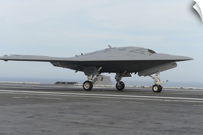 An X-47B Unmanned Combat Air System Conducts A Touch And Go Landing